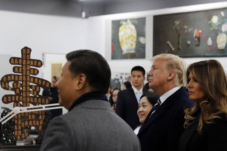 Xi Jinping junto a Donald Trump