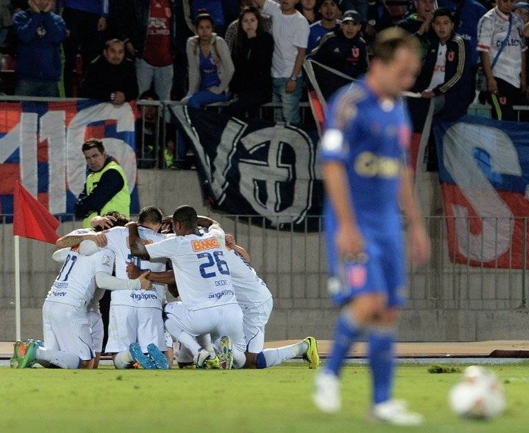 El festejo de Cruzeiro en el Nacional ante la U el 3 de abril de 2014 / Foto: AFP