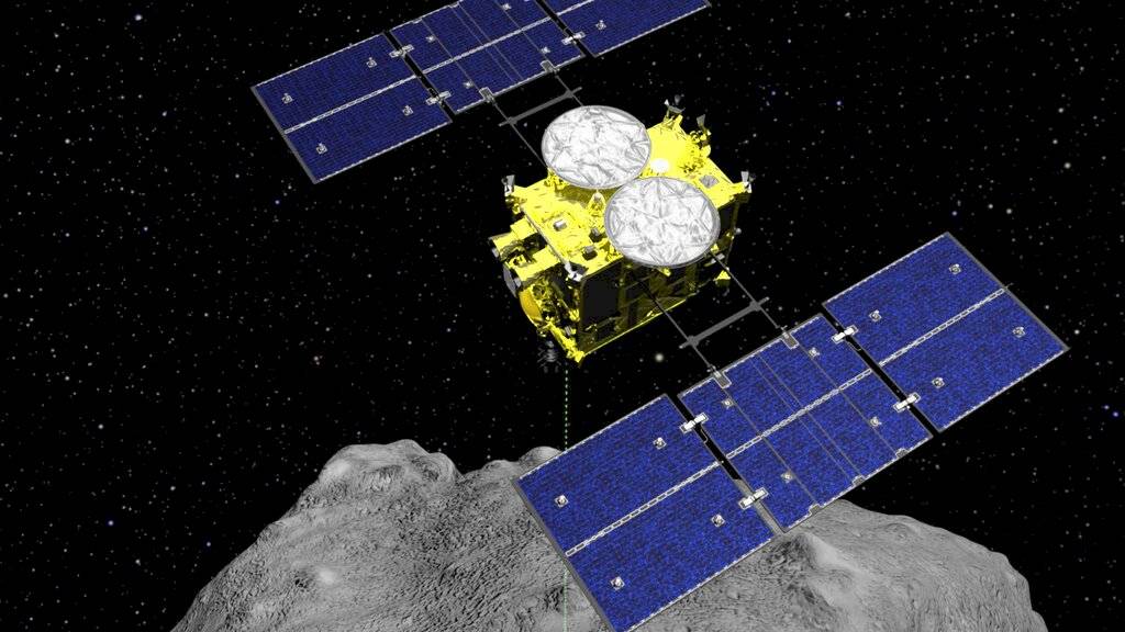 En esta imagen gráfica por computadora de archivo, publicada por la Agencia de Exploración Aeroespacial de Japón, se muestra la sonda Hayabusa2 sobre el asteroide Ryugu.